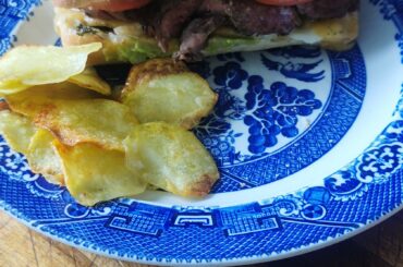 [Homemade] beef panini with chimichuri, smashed avocado with lime, tomato, crispy onions, double Gloucester with chive cheese and homemade potato crisps