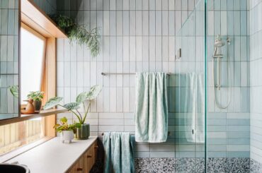 Ensuite bathroom clad with light blue tiles in a renovated Edwardian house, Brunswick West, Melbourne, Victoria, Australia [1668x2500]