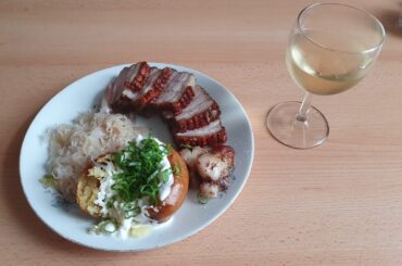 Roasted pork belly with baked potato and sauerkraut