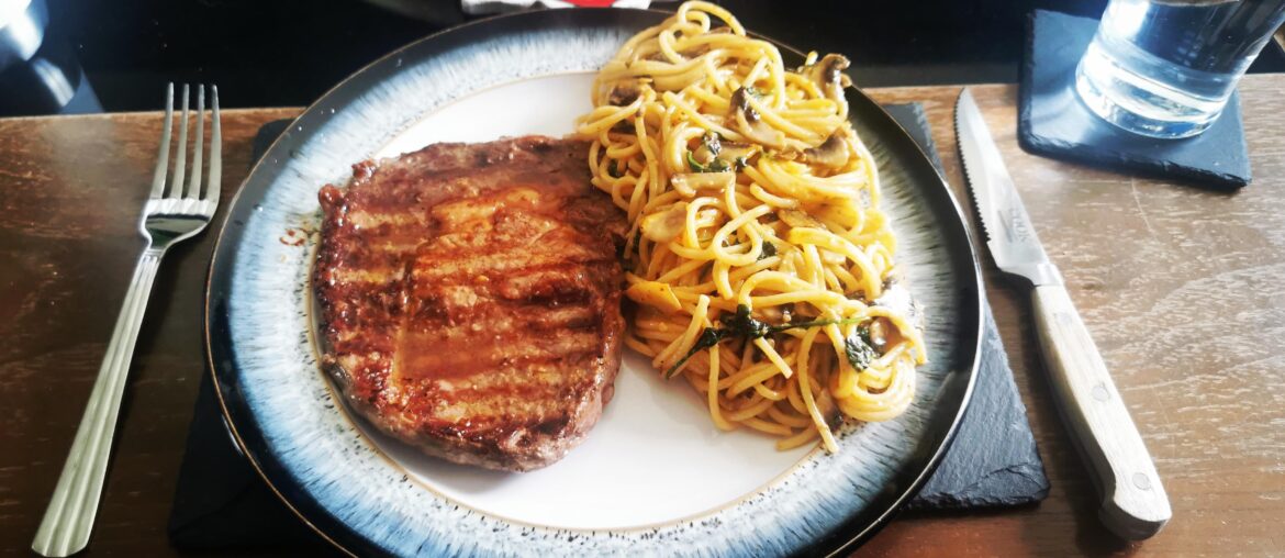 [Homemade] ribeye steak medium, finished with garlic butter, spinach and mushroom spaghetti finished with cream, tomato, mozzarella and truffle oil sauce