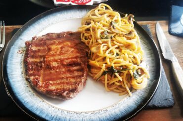 [Homemade] ribeye steak medium, finished with garlic butter, spinach and mushroom spaghetti finished with cream, tomato, mozzarella and truffle oil sauce
