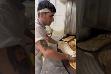 The art of martial arts in baking barbarian bread in Iran #shortsvideo #bread