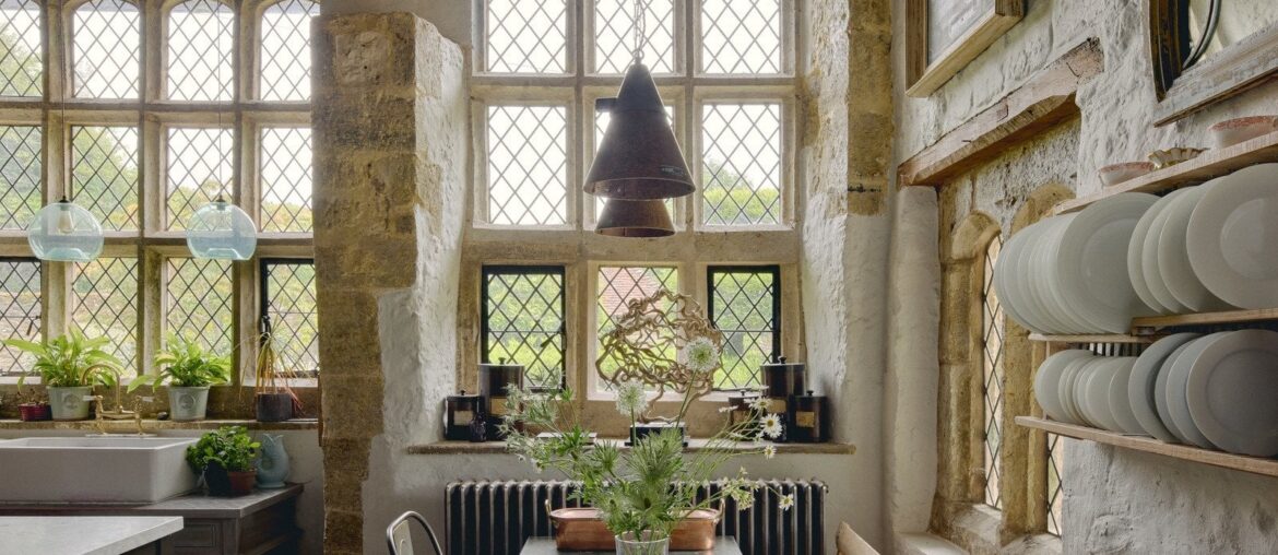 Great hall with stone mullioned windows and leaded casement lights in a restored and renovated 13th-century manor with 16th and 18th-century additions, Pulborough, West Sussex, England [1600x1067]