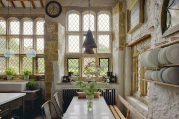 Great hall with stone mullioned windows and leaded casement lights in a restored and renovated 13th-century manor with 16th and 18th-century additions, Pulborough, West Sussex, England [1600x1067]