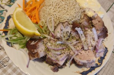 Pork neck and rice cooked in the meat's juices