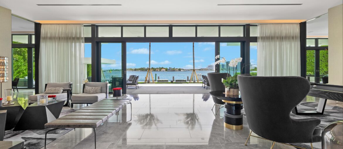 Living Room with Floor to Ceiling Windows and Large Sliding Doors in a Miami Beach, FL Home That Recently Sold for $45,000,000 [5000×3333]
