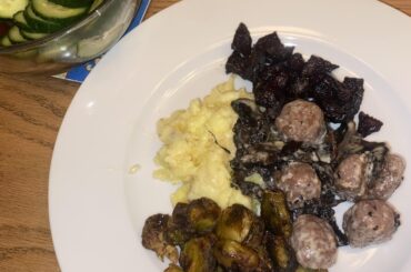 meatballs & mushrooms in a light cream sauce with mashed potato, roasted brussels sprouts & beets, and pickled cucumbers