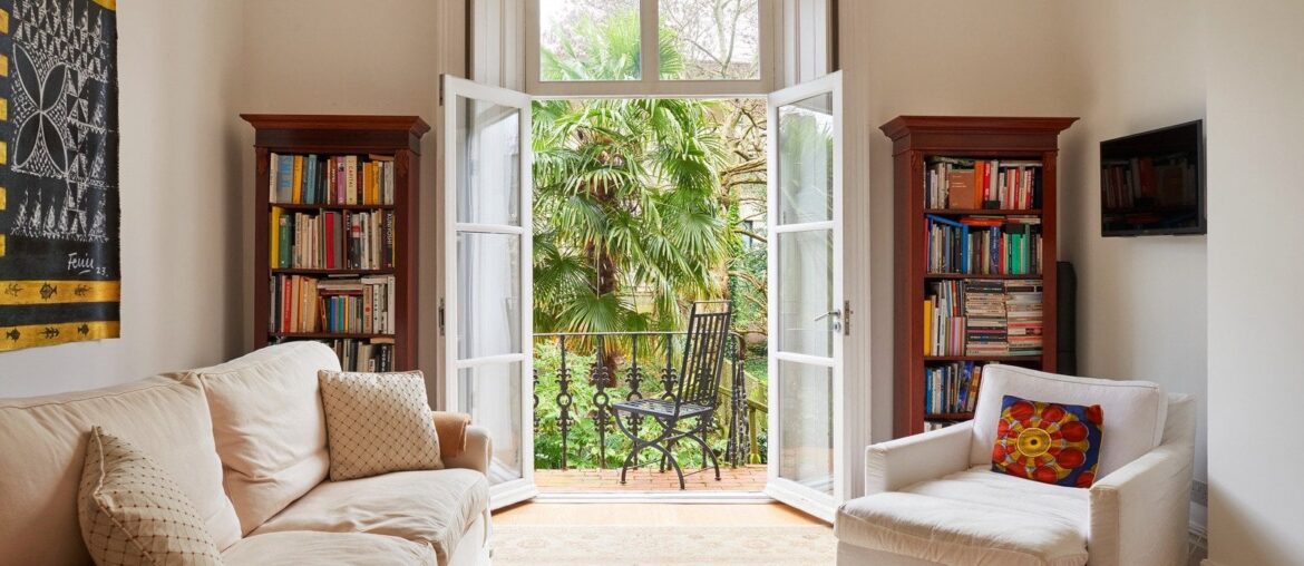 Living room with a small balcony in a Victorian house, Camden, London, UK [1600x1067]
