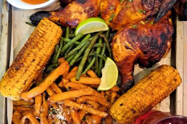 My attempt at a homemade Nandos. Piri-piri chicken with garlic and parmesan chips, greenbeans and corn