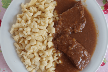 Even better reheated! Beef cutlets in red wine sauce with Nockerl (egg noodles).