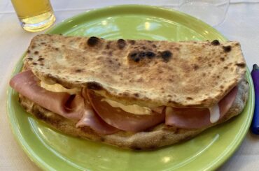 Open calzone, with mortadella, stracciatella and lemon zest!