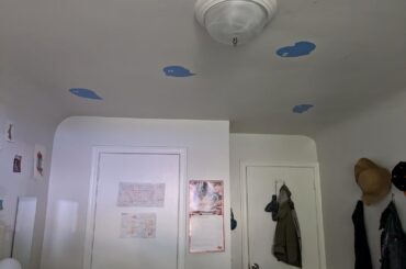 I want to paint the walls or put on contact wallpaper, but the ceiling corners are rounded. How to go about this?