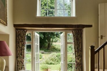 Garden views from an 18th-century farmhouse in the Cotswolds village of Taston, Chipping Norton, Oxfordshire, England [712x1067]