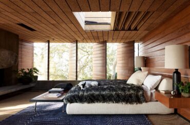 Bedroom with pivoting wood panels in a midcentury home in Silver Lake, Los Angeles [2208x1472]