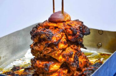 Oven roasted chicken shawarma served with hummus, radish, red onion pickles and tangy green herb sauce