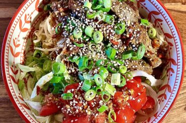 Homemade bowl with beef, rice noodles and chilli-ginger-lime sauce