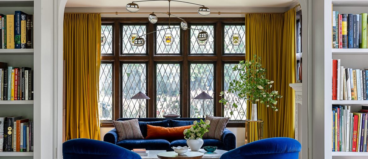 Built-in bookshelves around the archway in a renovated 1920s Tudor Revival residence, Louisville, Kentucky [3648x5472]