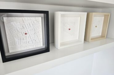 Made these 3D city map thingies - kinda dig how they look on the shelf!
