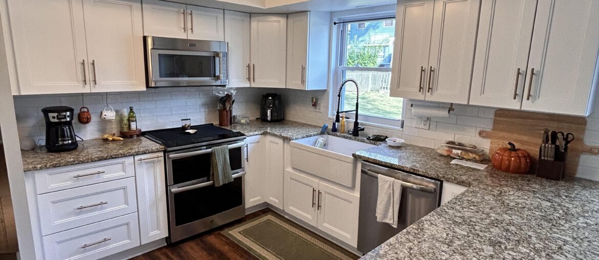 Update on the stark white kitchen with the “welcome” sign