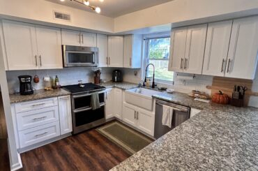 Update on the stark white kitchen with the “welcome” sign