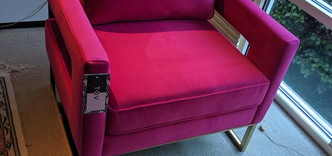 What color furniture to mute down a neon pink accent chair?