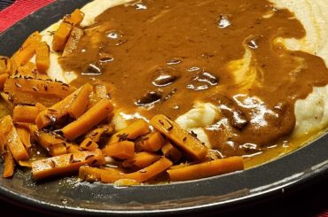 Meatballs in a creamy onion and bacon sauce, served with glazed caraway carrots and homemade mashed potatoes