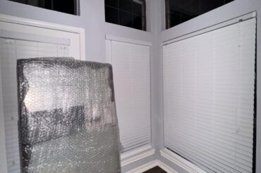 Propping up free standing mirror near windows