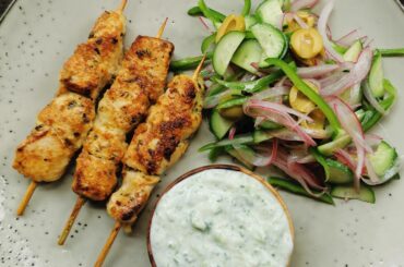 Greek style marinated chicken kabobs, salad and tzatziki lo