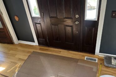 Help settle a debate: what size/shape rug for weird foyer?