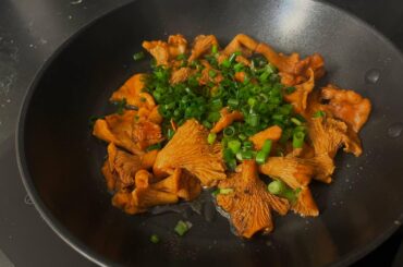Fried chanterelle mushroom with green onions