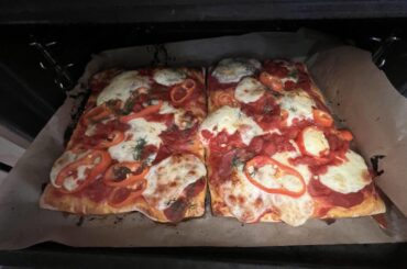 Two square pizzas in the oven