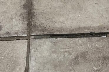 Can this tile floor be saved/repaired?