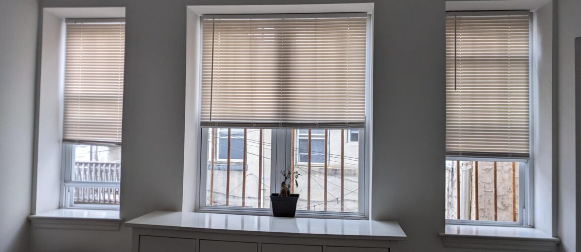 How should I hang curtains over these windows? 1 rod?