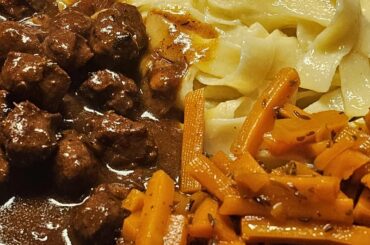 Meatballs made from Bratwurst meat and glazed caraway carrots from leftovers; served with Fettuccine