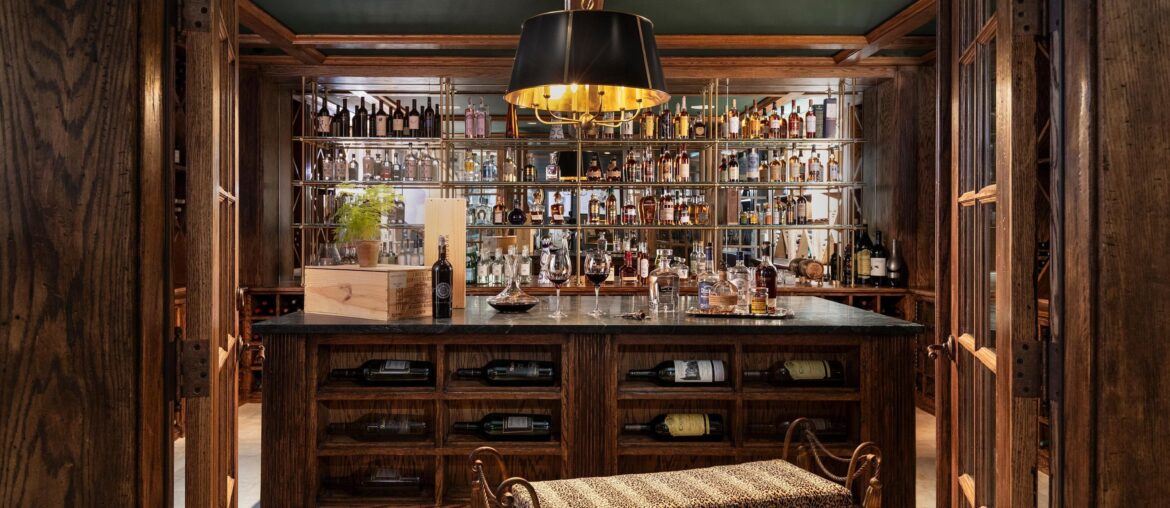 Well-stocked home bar in a maximalist house, Chicago suburb of Hinsdale, Illinois [3000x1791]