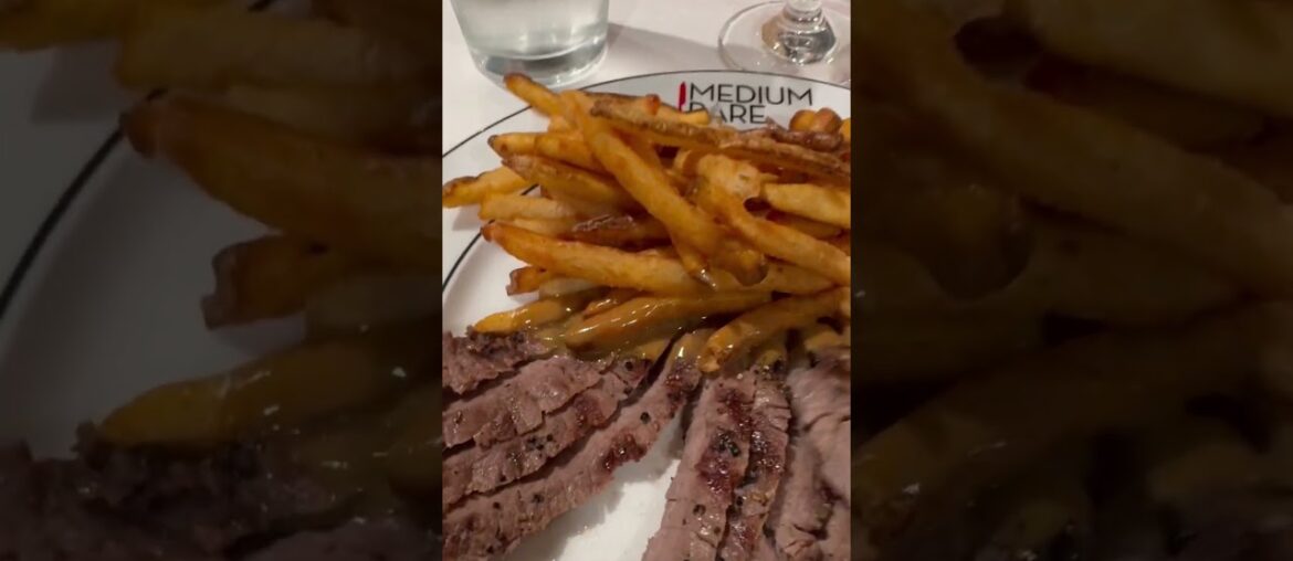 Medium rare steaks with French fries