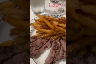Medium rare steaks with French fries