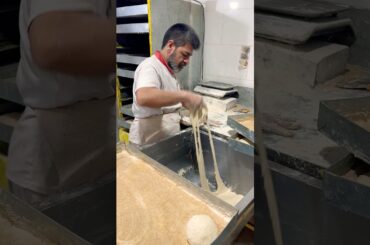 The skill of making a circle of barbarian bread dough #iranianbread #shortsvideo