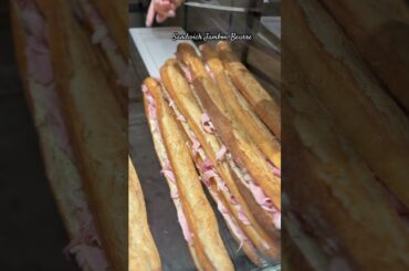 A sandwich jambon-beurre is a classic French sandwich made with a crispy baguette, butter, and ham.
