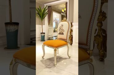 This French round dining table set brings together classic carving and playful citrus tones.