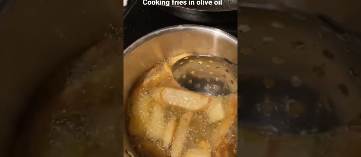 Frying French Fries In Olive Oil Frying French Fries In Olive Oil