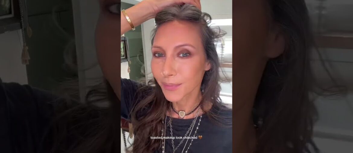 Smudgy espresso eyes, lips in deep wine, and French Face to keep her whole look elevated.