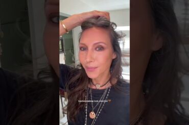 Smudgy espresso eyes, lips in deep wine, and French Face to keep her whole look elevated.