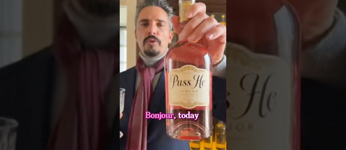 Say what?!! French wine snob shows off his pink bottle of Puss He liquor. Umm… we have questions. 🤣