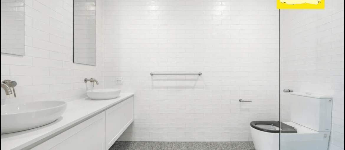 How can I minimise the look of the overly large disabled toilet?