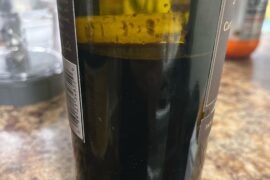 Wine cap fell into liquid.