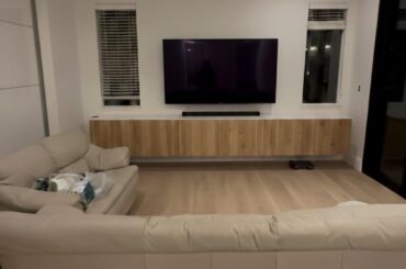Floating tv cabinet wall to wall or centered with 8 inches in each side?
