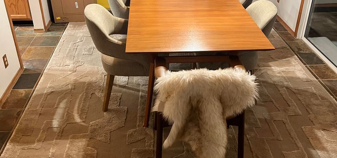 Is my rug too big? Should it be centered on the room or the table/hanging lights?