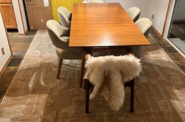 Is my rug too big? Should it be centered on the room or the table/hanging lights?