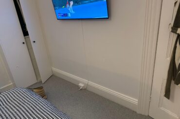 Any ideas to cover up this electrical outlet?